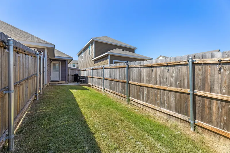Fully fenced green backyard