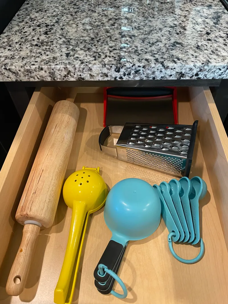Rolling pin, grater, citrus press and measuring spoons