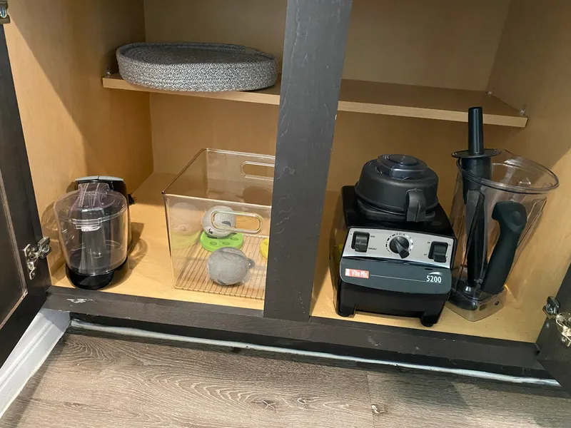 Blender and small appliances in a cabinet